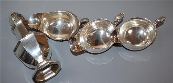 A pair of George V silver sauceboats, one other silver sauceboat and a silver sugar caster, 17.5 oz.